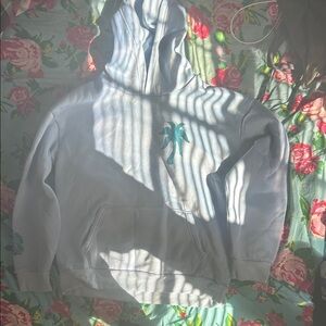 Light Blue Hoodie with Palm Tree Design